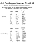 Adult Paddington Bear Sweater size chart displaying chest and length measurements in inches and centimeters for XS to XXL