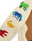 A close-up of the sleeve of a kids' sweater, highlighting intricate embroidery of a frog, horse, duck, and bird.