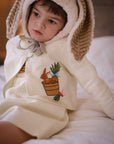 Toddler wearing Little Goodall embroidered linen bunny jacket with bushel basket design. Lightweight, heirloom-quality cardigan for boys and girls