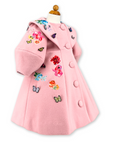 Angled view of Rainbow Bloom Girls Coat in pink wool, featuring vibrant floral embroidery, large buttons, and 3D butterfly details