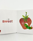 Open pages of Love From The Very Hungry Caterpillar book featuring the caterpillar and a strawberry with the words 'so sweet
