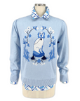 Powder blue cotton sweater with Willa Heart dog and dragon motif, tassels, ribbed cuffs, and pleated shoulders