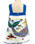 Back view of a sleeveless mermaid dress with blue straps, a central zipper, and an underwater scene featuring jellyfish, fish, and a vibrant mermaid tail