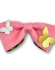 Pink Rainbow Dreamer bow crafted from brushed wool, lined with colorful rainbow satin, and embellished with metallic butterflies