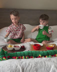 video showcasing two boys wearing the very hungry caterpillar strawberry shirt and food party themed- shirts with reversible roper and caterpillar green shorts