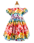 Rainbow Bloom Party Dress with a vibrant floral butterfly print, puff sleeves, pink waist bow, and full skirt, perfect for special occasions
