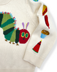 Detailed shot of Hungry Caterpillar knit sweater with bright embroidered foods decorating the sleeve