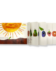 Inside pages of The Very Hungry Caterpillar Board Book showing the caterpillar eating through colorful fruits with die-cut holes