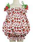 Whimsical strawberry-print baby romper with tie shoulders and ruched elastic trim.