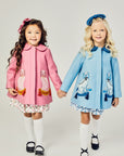 Pink Coat with two pink dogs on it next to the blue version with two blue dogs