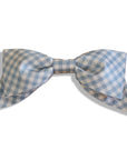 Blue gingham hair bow with an oversized design, handmade and attached to a secure alligator clip