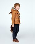 Child wearing Little Goodall Luxe Fox Coat with fox hood, toggles, and detachable tail