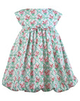 Mint-colored girls' dress with a carrot and dot pattern, cap sleeves, and a gathered balloon hem