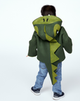 Back view of the Little Goodall Cheeky Green Dinosaur Coat, featuring a ridged hood, plush-lined tail, and soft wool-felt fabric for a fun, cozy fit.
