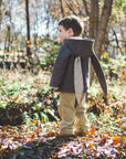 Child wearing the Little Goodall Flopsy Bunny coat, showing back view with long bunny ears and cozy wool blend fabric for cool weather