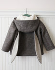Back view of Little Goodall Flopsy Bunny coat, showing soft wool fabric, plush lining, and long bunny ear hood.