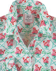 Close-up of button-down shirt collar with foo dog print in teal and plum on cotton sateen