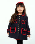 Dark blue wool winter coat with red trim, gold buttons, and A-line fit. Stylish and warm for cold weather.