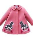 Girls pink wool coat with black and white zebra appliqués and pink tassels, designed in collaboration with Willa Heart.