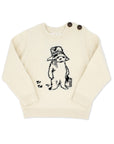 Kids Paddington Bear sweater in cream, 100% cotton, featuring classic Peggy Fortnum illustration, unisex design with button-shoulder detail.