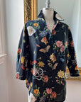 Little Goodall Midnight Grand Botanical Shirt displayed on a mannequin, showcasing its black cotton sateen fabric with a floral and insect print