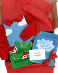 Little Cloud Gift Set with a merino wool jumper, red bow blouse, and Little Cloud hardcover book, beautifully packaged in a gift box.