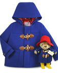 Gift Sets; a royal blue wool toggle coat with wooden fastenings, red satin lining, and a hood, plus a 10" Paddington Bear plush
