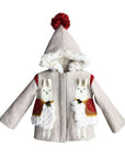 Front view of the Little Goodall Lucky Llama Coat, a beige wool jacket with faux fur trim, red pom-pom hood, and playful llama appliqués.