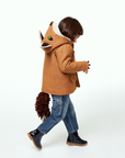 Child walking in a wool fox coat with a hood featuring fox ears and a detachable tail