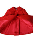 Inside view of red wool Matryoshka coat for girls, showing luxurious satin lining and concealed button closures