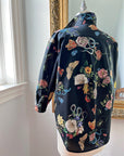 Rear view of the Midnight Grand Botanical Shirt by Little Goodall, featuring a black cotton sateen fabric with an intricate floral and insect print