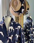 Little Goodall Navy Pedigree Shirt styled with a straw fedora wrapped in a coordinating Greyhound-print scarf