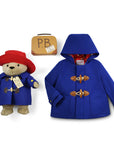 Paddington Bear Gift Set with a royal blue toggle coat, 16" plush bear in a matching coat and red hat, plus a vintage-style suitcase labeled "PB