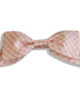 Pink gingham hair bow with an oversized design, handmade and attached to a secure alligator clip