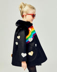 Girls' black winter coat with rainbow detail, faux fur collar, and gold and silver heart appliqués