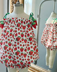 Strawberry bubble romper with Eric Carle’s Very Hungry Caterpillar print, tie-shoulder straps, and ruffled trim.