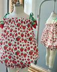 Strawberry bubble romper with Eric Carle’s Very Hungry Caterpillar print, tie-shoulder straps, and ruffled trim.