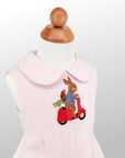 Charming pink linen dress for girls, featuring an embroidered bunny on a scooter. A perfect heirloom-quality outfit for summer time festivities