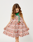 girl in a strawberry print summer dress with playful tiers.