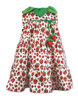 Strawberry print dress with a green leaf collar, tiered skirt, and decorative strawberry ties, made from lightweight cotton.