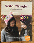 Cover of "Wild Things to Sew and Wear" book featuring two girls in owl hats