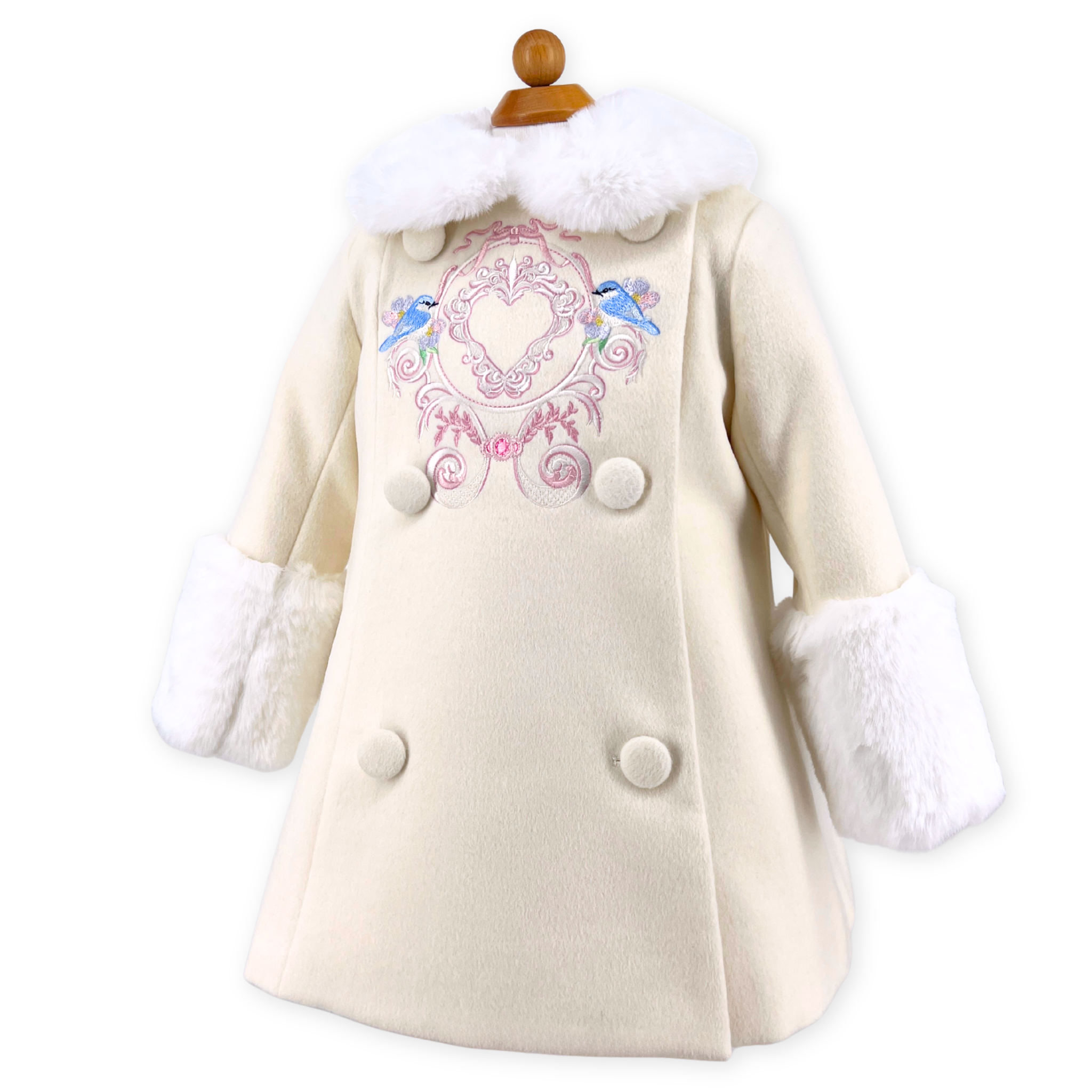 White coat with bluebird embroidery and fur trim on a white background