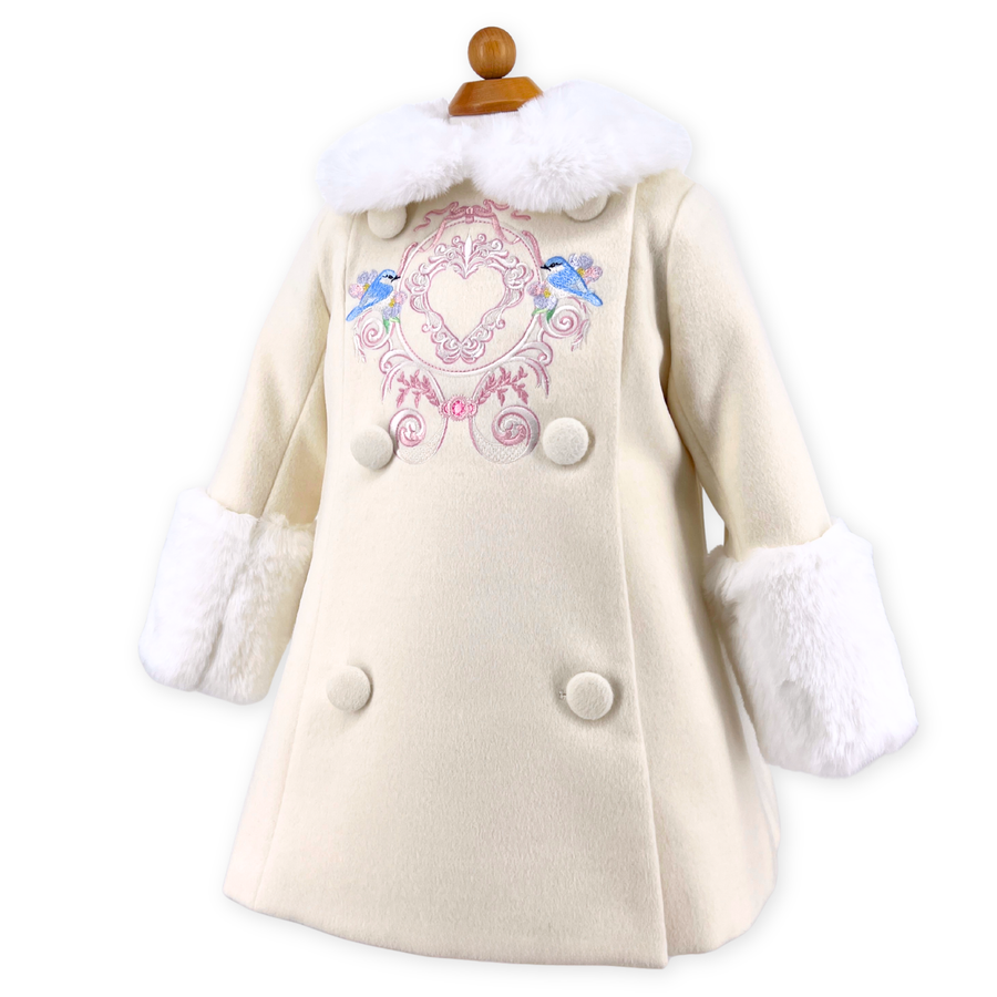 White coat with bluebird embroidery and fur trim on a white background