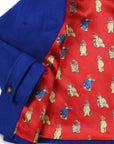 Lining of Paddington Blue duffle coat with toggles with red print of Paddington Bear