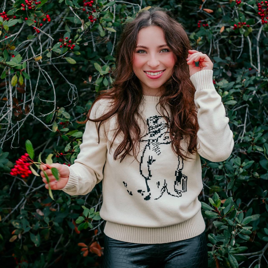 Woman wearing the Adult Paddington Bear Sweater  ab ivory cotton knit sweater with classic Peggy Fortnum Paddington Bear illustration