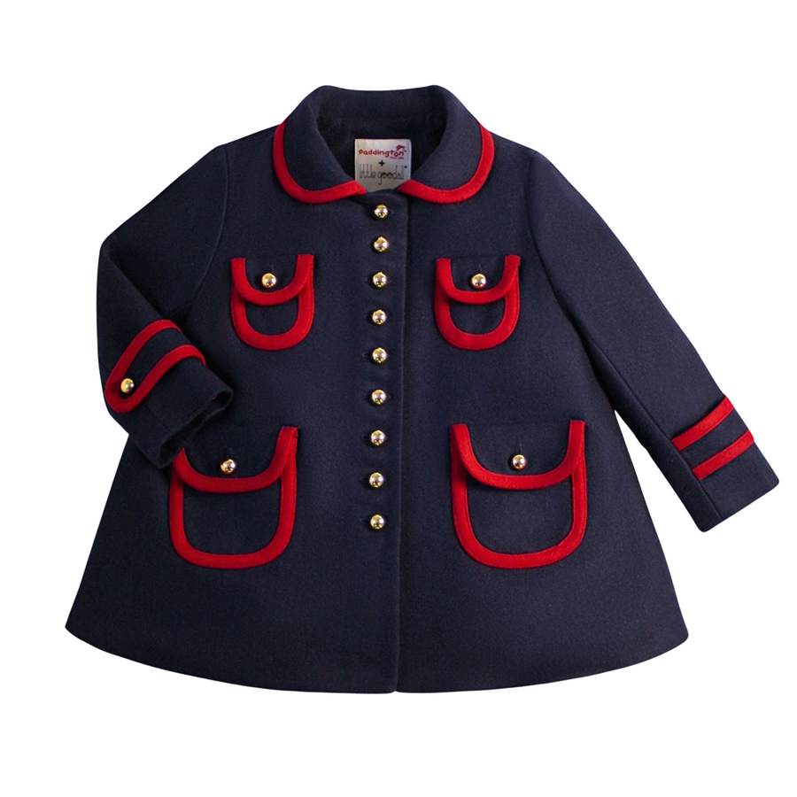 Girls dark blue wool winter coat with red trim, gold buttons, and satin print lining. A-line design with pockets and sleeve tabs.