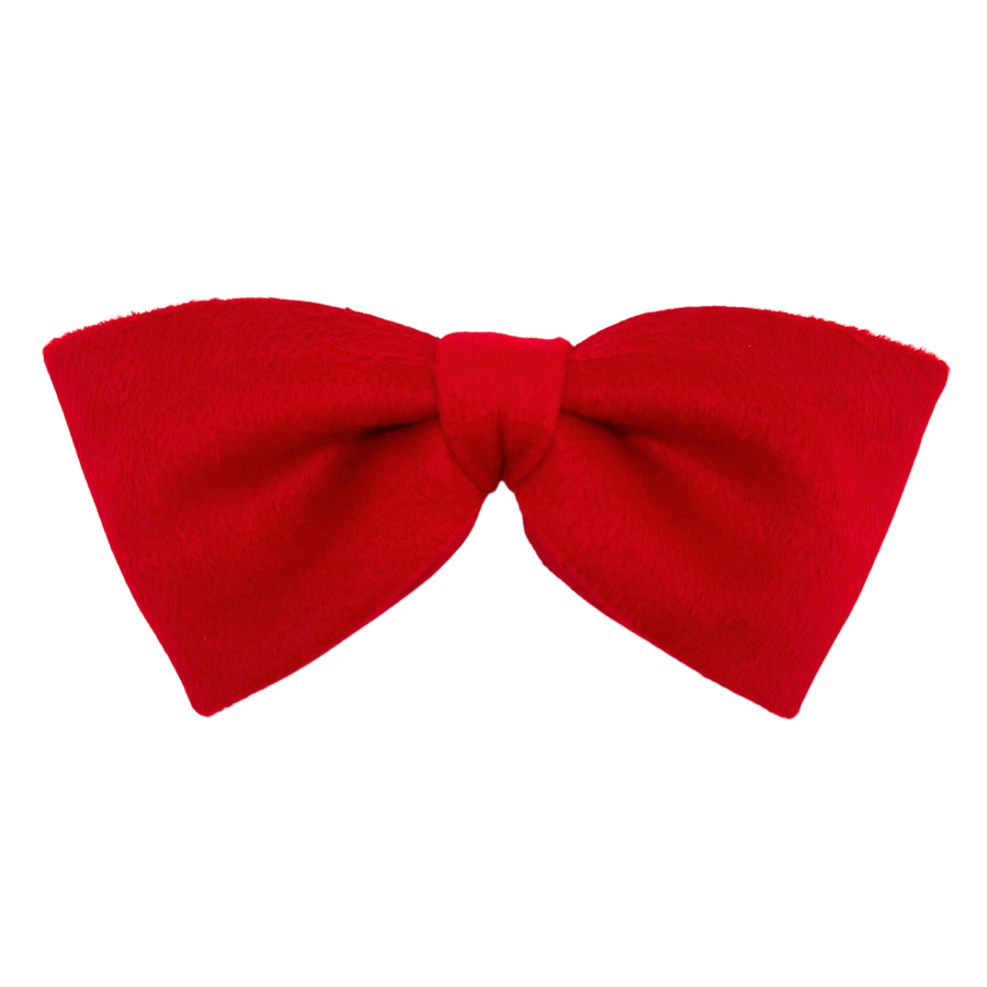 A large red hair bow made from brushed wool, hand-pleated to perfection with visible texture, secured by a French barrette spring clip