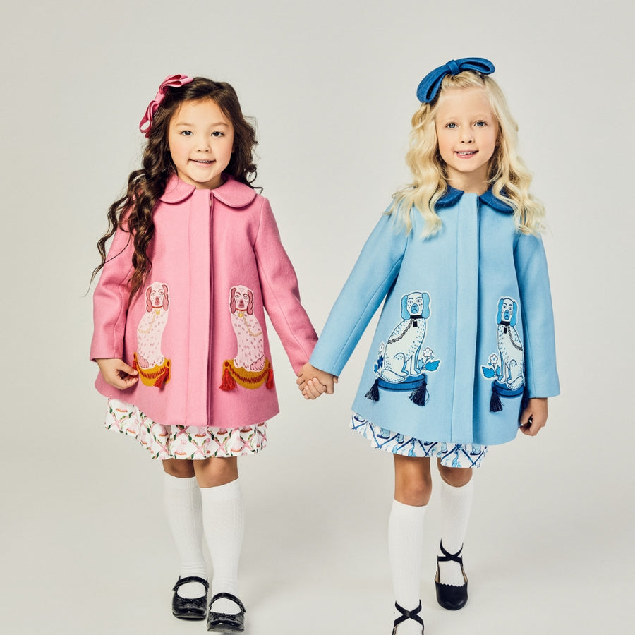 Pink Coat with two pink dogs on it next to the blue version with two blue dogs