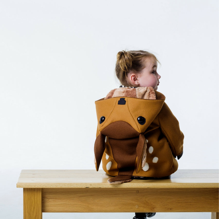 Back view of brown fawn coat on girl model with the hood down, displaying the fawn hood.