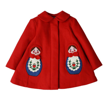 red wool coat with collar and hidden buttons beneath placket with two embriodered matryoshkas on left and right side of coat